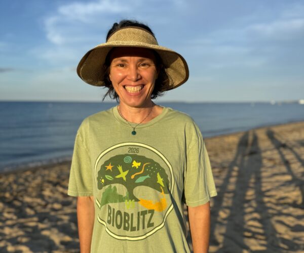 Liz Loucks, who tallied 318 species, looks happy with her event T-shirt.